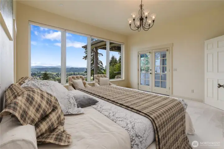 Master Bedroom with French doors to Patio and that beautiful view. Virtually staged.