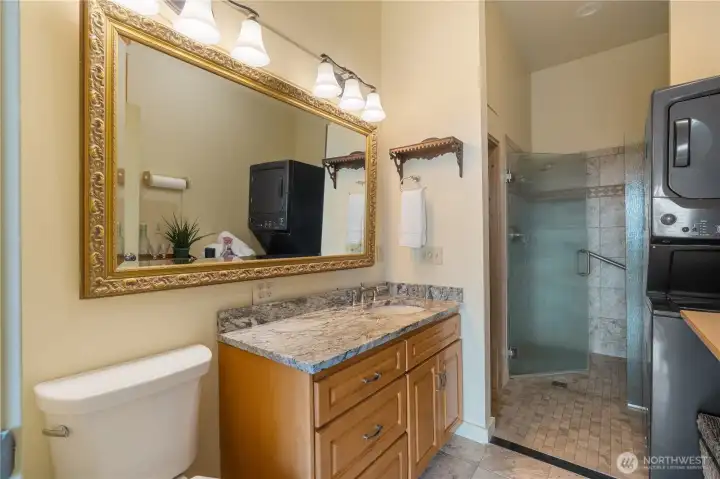 The "Sauna Bath" has step in shower, washer & dryer stack combo built in cabinets, and of course, a sauna.
