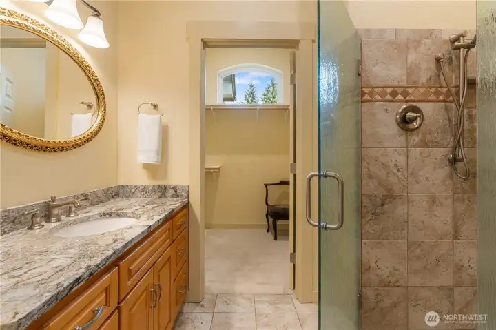 Guest bathroom shot with closet set-up in background.