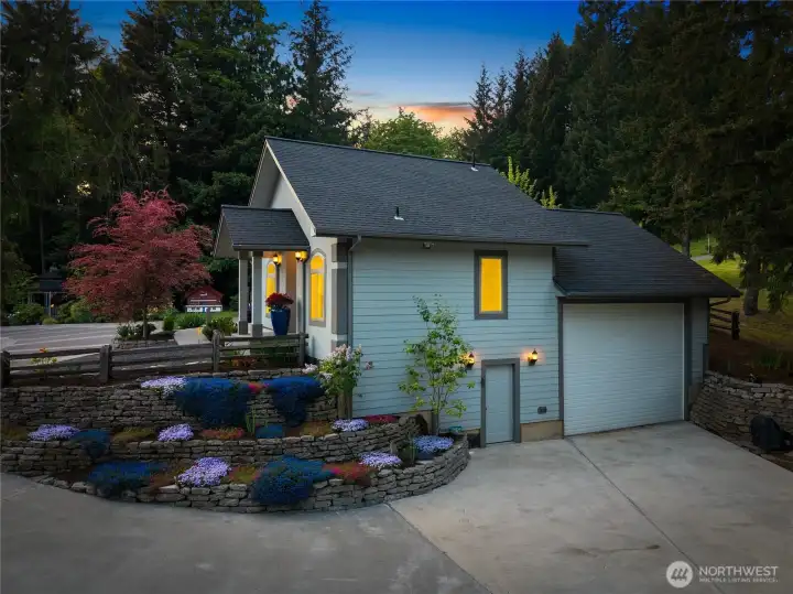 Side view of the Lodge reveals the lower shop area that has shop benches, heater, 220V power and 1/2 bathroom.
