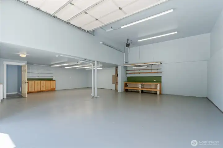 Interior of Lodge shop. Garage bay is plenty tall to add a car lift. Heater, 220V power and 1/2 bath.