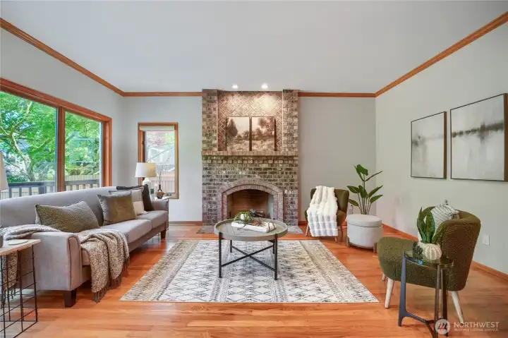 Spacious seating area with hardwood floors and room for gatherings.