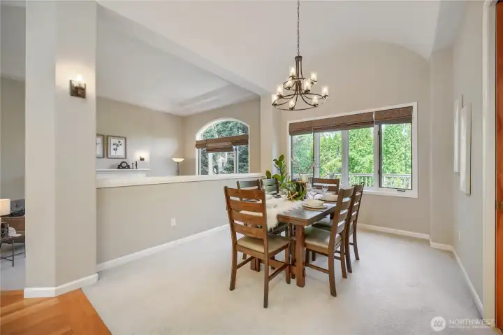 Formal dining room with bright walls.