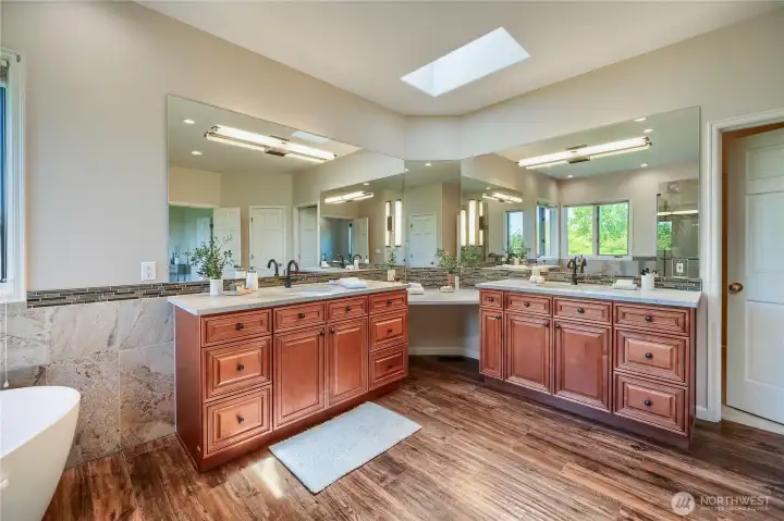 Dual vanities in this spa like luxurious bathroom.