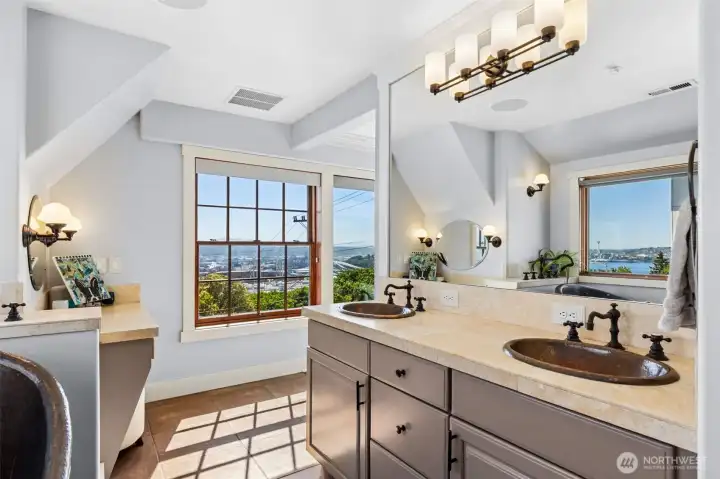 Dual copper sinks, expansive walk-in rain shower, and dressing table.