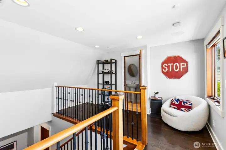 A private loft suite crowns the home, complete with its own 3/4 bath and mezzanine.