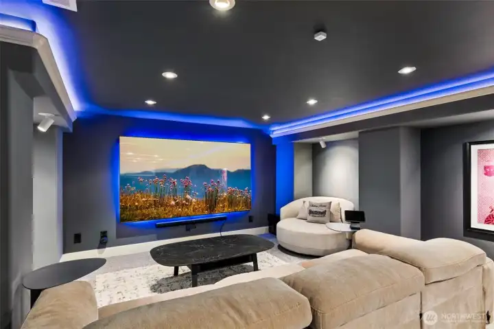 Media room features 98" Samsung 4K smart tv with cabling for multiple audio chanels, 19" media rack with smart cabling and speaker connections (for the entire home)