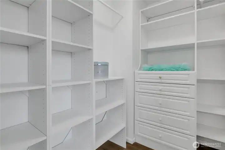 Primary bedroom walk-in closet