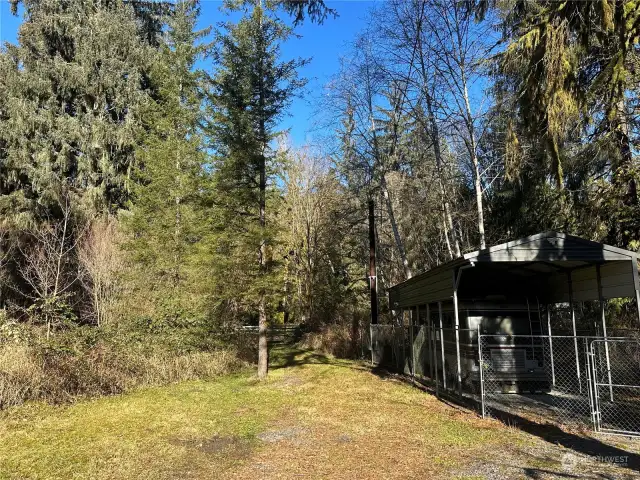 Motorhome sits to the front of the property.