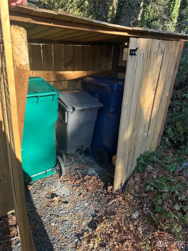 Convenient, on street, locked garbage can storage.