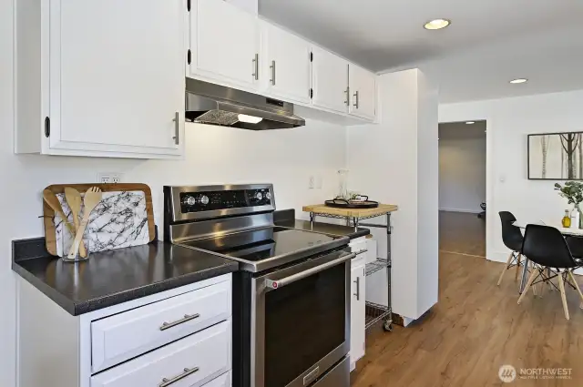 Spacious kitchen with stainless appliances.