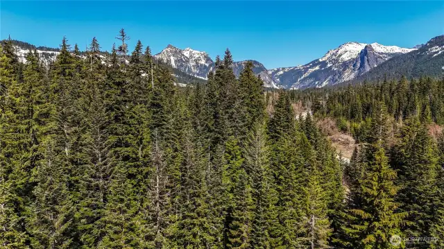 Aerial photo directly above lot. Denny Mtn, Alpental & Guye Peak in th background.
