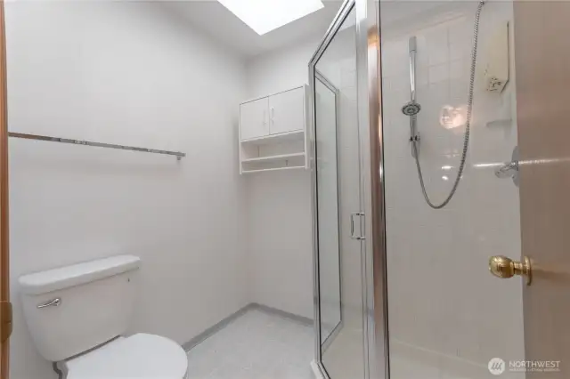 Primary bathroom stool and shower.