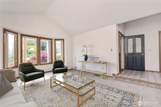 Entry and virtually staged living room.