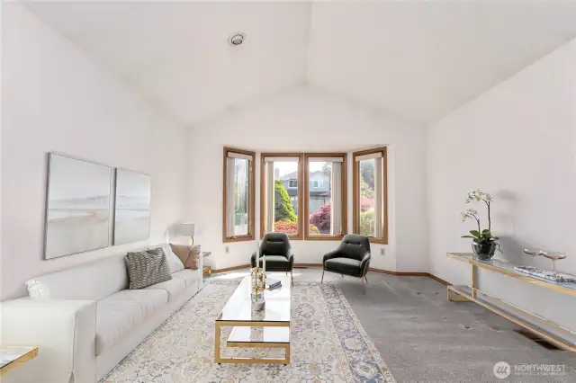 Virtually staged living room with bay window.