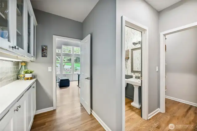 Half bath to the right for day guests, walk-in pantry and butler's pantry.