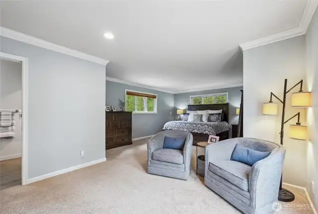 The primary suite has a large seating area, Juliette balcony, walk-in closet and a fully remodeled spa-like bath.