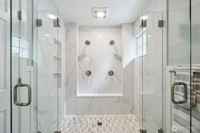 . . . and a huge shower with double glass doors and dual shower heads.