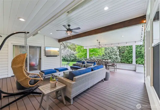 The sellers added this fabulous covered deck off the great room. There are heaters so you can enjoy it all year long.