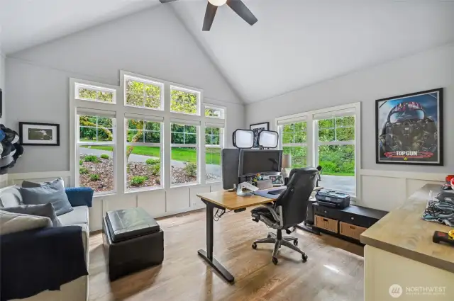 To the left of the entry is the main floor office with a dramatic window wall. This could also be a formal dining room.