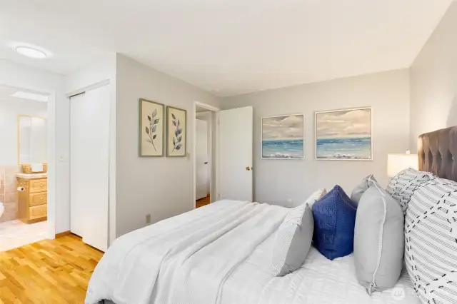 The primary features direct access to the full bathroom.