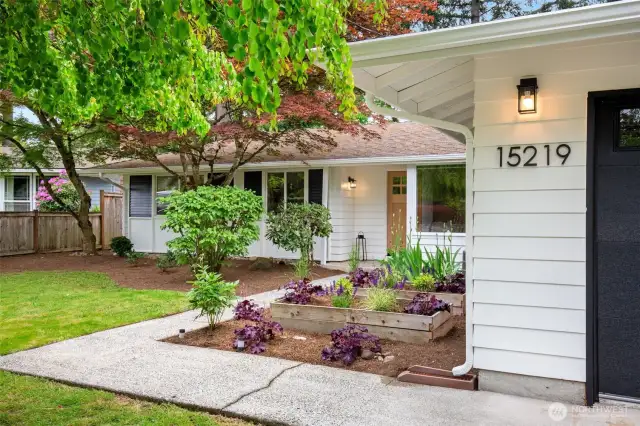 Fresh exterior paint and new front door add charm to this mid century home.