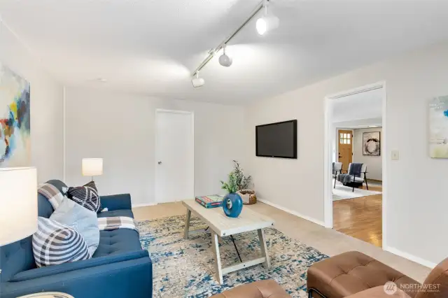 Flex space with direct access to the large rear deck, laundry, 3/4 bath, and garage.