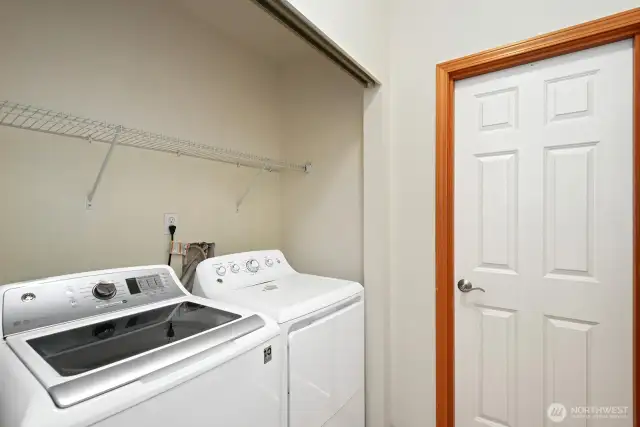 Laundry off of garage entrance and half bathroom.