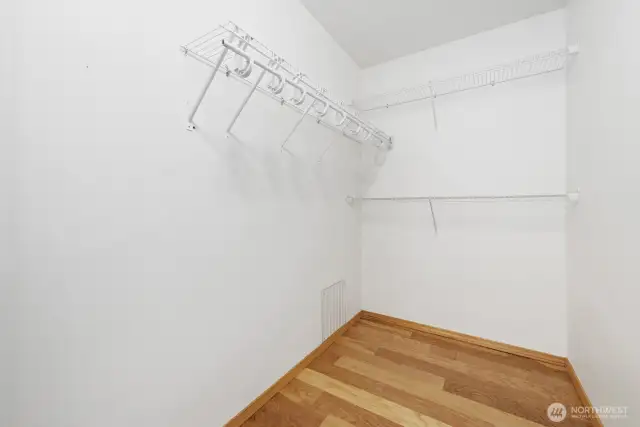 Walk-in closet for primary bedroom.
