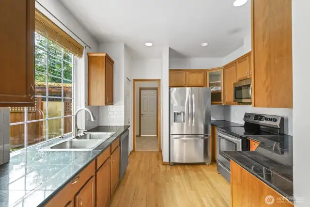 Kitchen that overlooks fully fenced back yard.