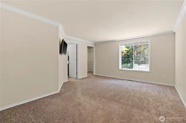 Welcome to the primary suite with its own ensuite bath and walk in closet