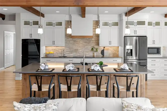 A gourmet kitchen, geared toward gatherings.