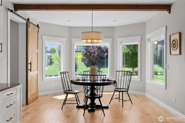 A casual dining nook just off the kitchen provides peaceful views outside with southern-facing light.