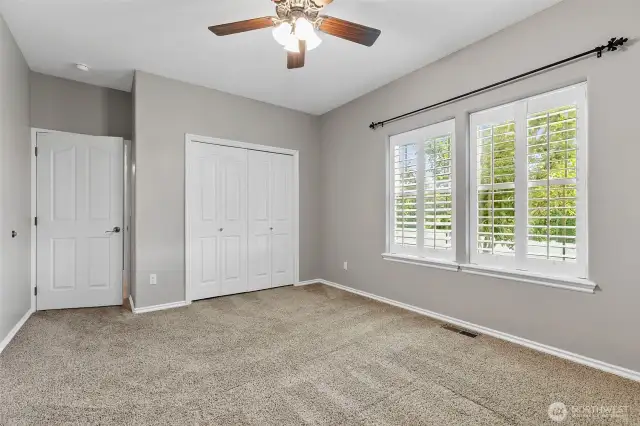 The second main floor bedroom also features its own bath.