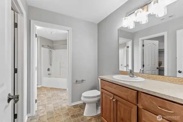Between bedroom 4 and 5, two half baths are joined by a tub and shower for a combination of shared and separate bath facilities.