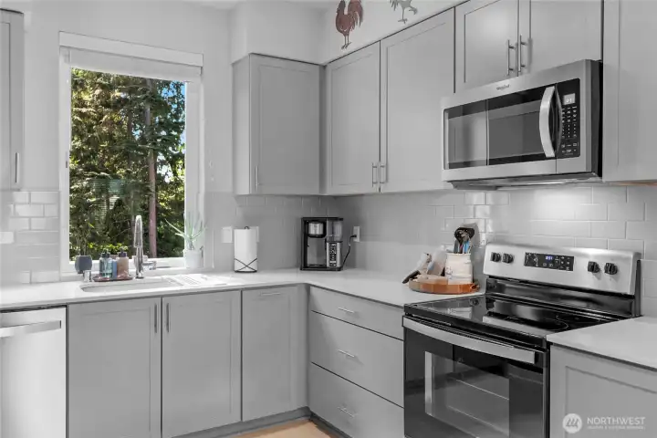 Open kitchen with abundant cabinet storage