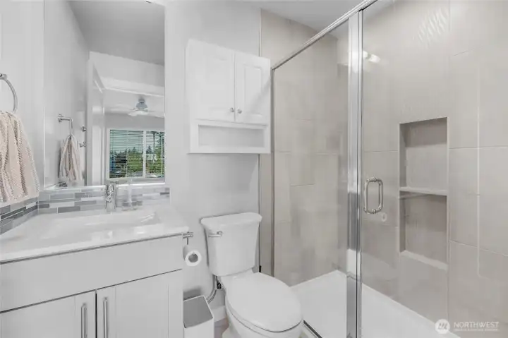 Primary bathroom with walk-in shower.