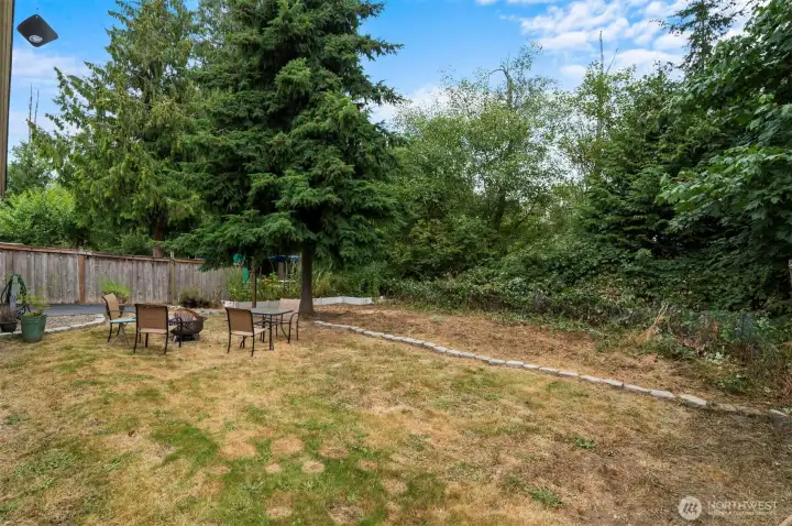 Escape to a private, peaceful backyard, ideal for summer BBQs and family gatherings.