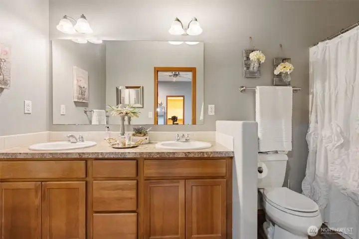 Primary bathroom with tub shower and 2 sinks