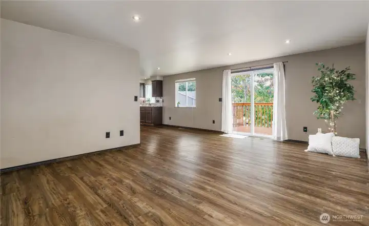 Living room open to Dining and Kitchen