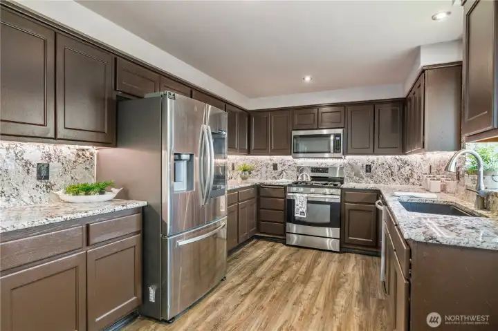 Stainless steel appliances remain with home.  Plethora of counterspace