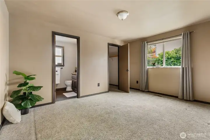 Primary bedroom complete with private bath and walk in closet