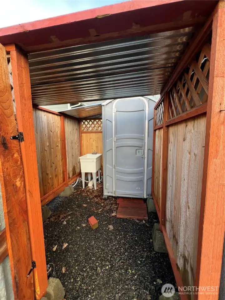Portable toilet and utility sink.