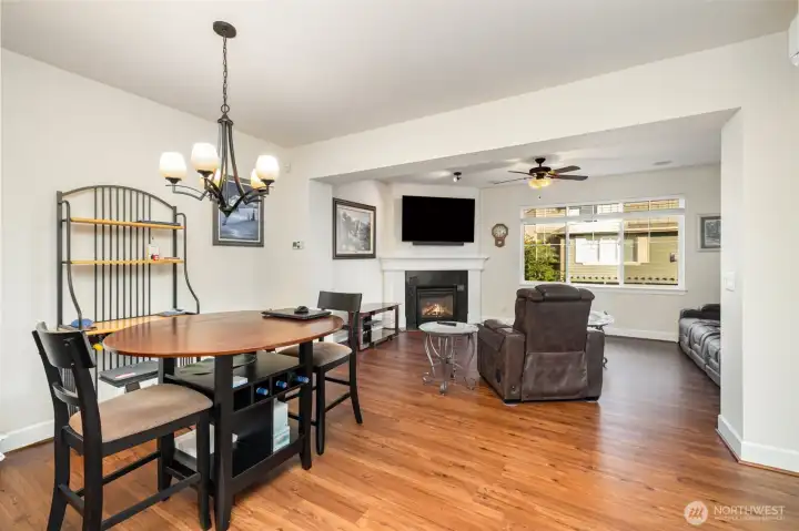 Functional architectural details subtly separate the living and dining areas.