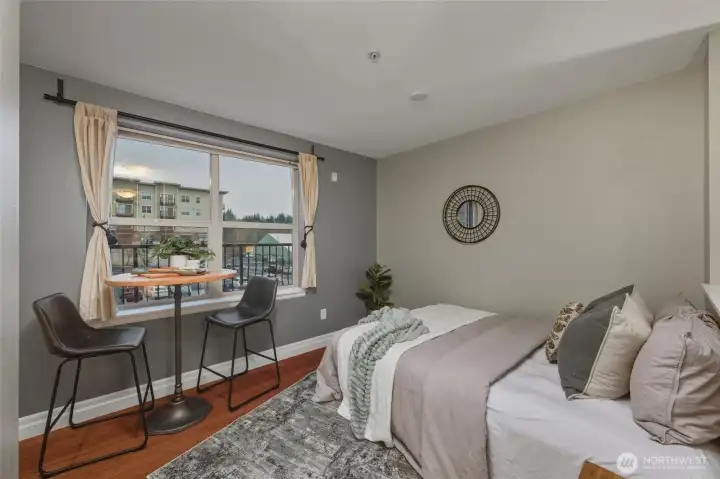 Dining Nook - Light-Filled and Laid Back  This charming dining space is perfectly positioned by a large window, offering treetop and neighborhood views. It’s the ideal spot for a sunny breakfast or evening glass of wine.