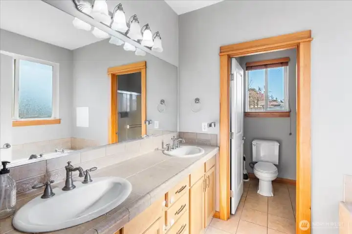 5 Piece Primary Bathroom with low lip step into shower.