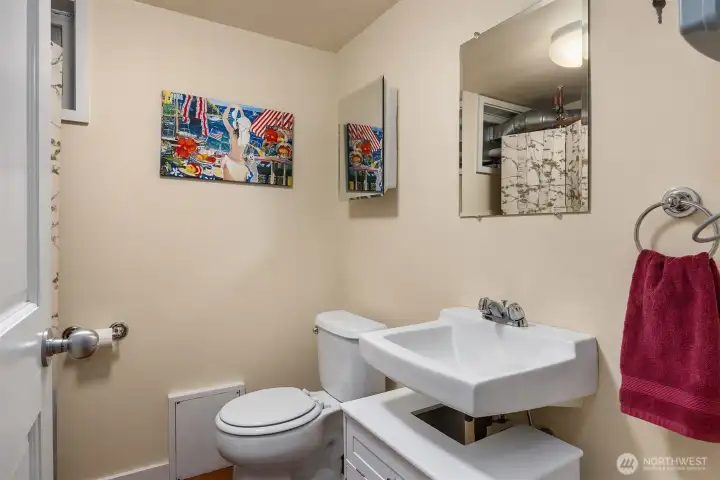 Half bath in lower level is common area, right down the hall from Unit A's bonus room