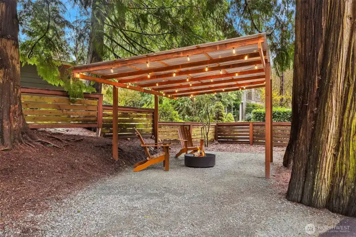 Covered carport area to the side of the driveway.