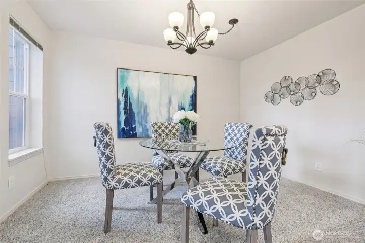 Large designated dining room with window for natural light