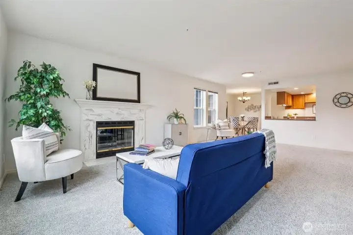 From corner of living room toward kitchen and dining room is open and ready for personal touches